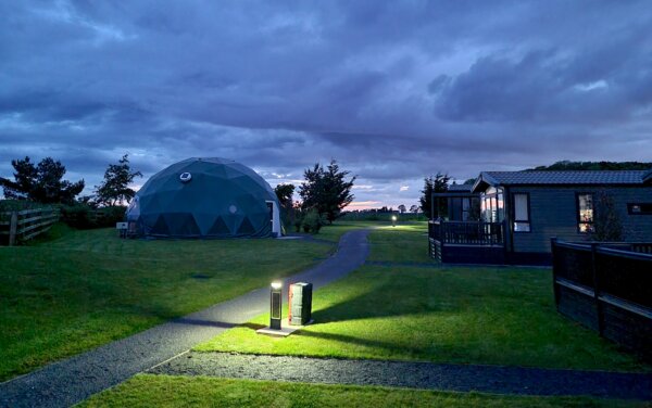 Dome and lodges at sunset at Angrove Country Park, North York Moors. 